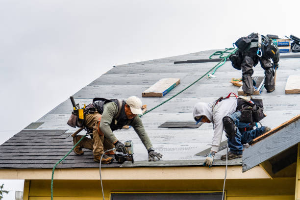 Professional Gutter Installation technician working in Hewlett, NY